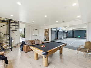 Recreation room featuring billiards, light wood finished floors, and recessed lighting