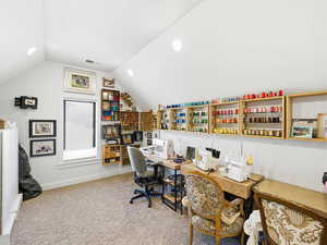 Office space featuring light carpet, lofted ceiling, and recessed lighting