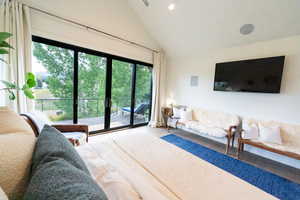 Bedroom featuring high vaulted ceiling, access to outside, and recessed lighting
