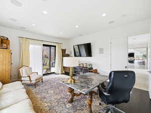 View of den, recessed lighting, and hardwood / wood-style floors