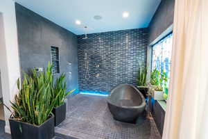 Sitting room featuring tile walls, recessed lighting, and tile patterned floors