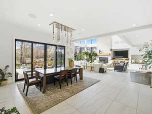 Dining area featuring recessed lighting and light tile patterned floors