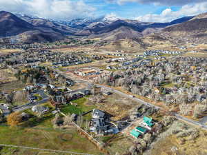 Aerial perspective of suburban area with a mountainous background
