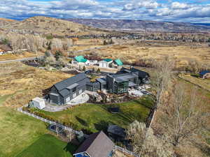 View from above of property with a mountain backdrop