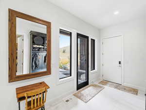 Foyer entrance with baseboards