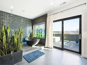 Reception featuring recessed lighting and tile walls