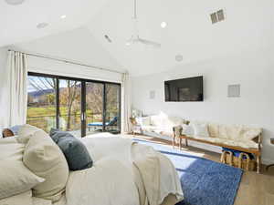 Bedroom featuring access to outside, high vaulted ceiling, ceiling fan, hardwood / wood-style floors, and recessed lighting