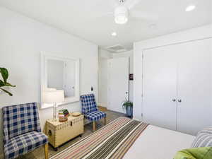 Bedroom with attic access, recessed lighting, a closet, and carpet flooring