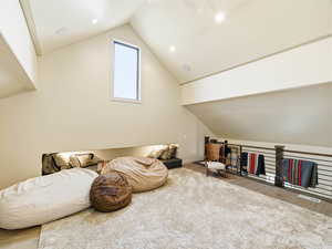 Loft  area featuring lofted ceiling and wood finished floors