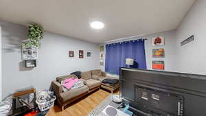 Living area featuring wood finished floors