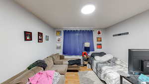 Bedroom with wood finished floors