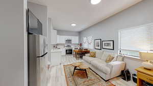 Living area with light wood-style flooring
