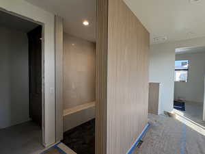 Hall featuring recessed lighting and concrete flooring