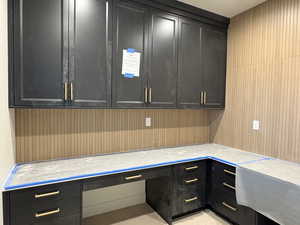 Unfurnished office featuring built in desk