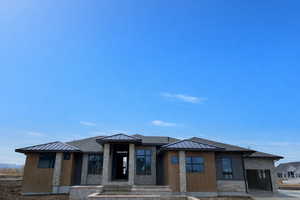 Prairie-style house with stone siding