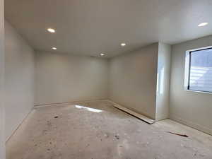 Unfurnished room with baseboards and recessed lighting