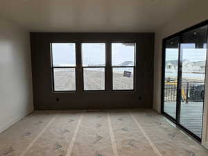 Unfurnished room with baseboards