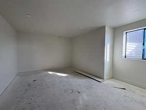 Unfurnished room featuring baseboards