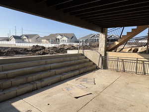 View of patio / terrace with stairs and a residential view