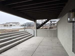 View of patio / terrace with stairs and a residential view