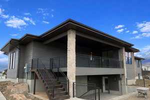 View of building exterior featuring stairway and a mountain view
