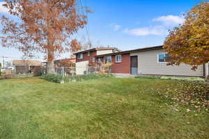 Back of property featuring brick siding