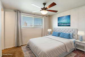 Bedroom with carpet floors and a ceiling fan