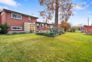 Back of property with brick siding