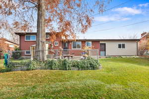 Back of house featuring brick siding