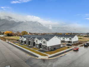 Aerial perspective of suburban area featuring a mountain backdrop