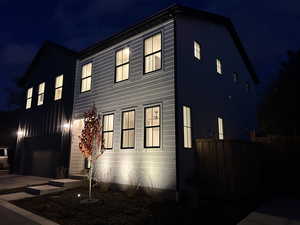 View of property exterior at night
