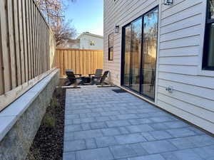 Fenced backyard with a patio area