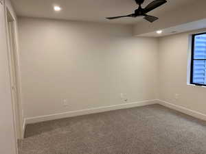 Spare room featuring ceiling fan, carpet floors, and recessed lighting