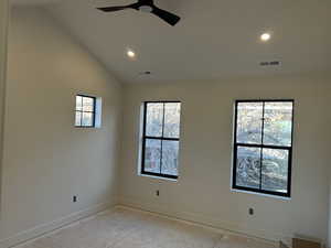 Unfurnished room with vaulted ceiling, a ceiling fan, and recessed lighting