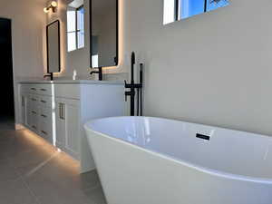 Primary Ensuite Bathroom with double vanity and a freestanding bath