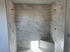 Bathroom with a tile shower