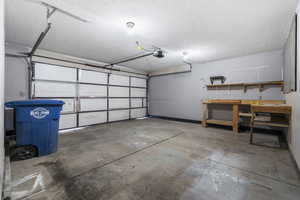 Garage featuring a garage door opener