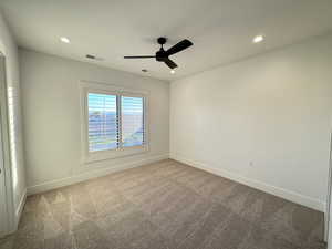 Unfurnished room with carpet floors, a ceiling fan, and recessed lighting