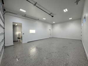 Garage featuring baseboards