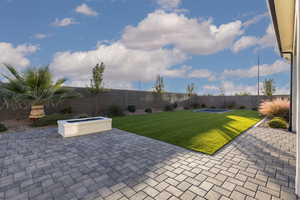 Fenced backyard featuring a patio area