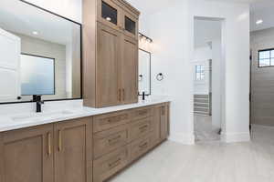 Full bathroom featuring recessed lighting, double vanity, and a walk in shower