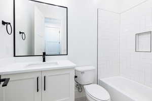 Full bathroom featuring vanity and  shower combination