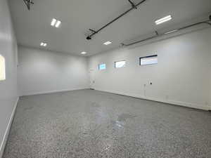 Garage featuring baseboards