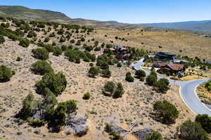 View of rural area with a mountainous background and a desert landscape