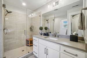 Master bath with vanity and a spacious hower