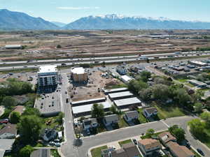 Aerial overview of property's location featuring a mountain backdrop