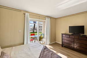 Bedroom featuring light wood-style floors and access to outside