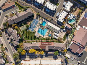 Aerial view of property's location featuring a pool area