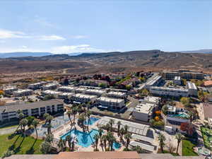 Drone / aerial view of a pool and a mountainous background