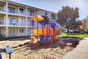 Community playground with a yard